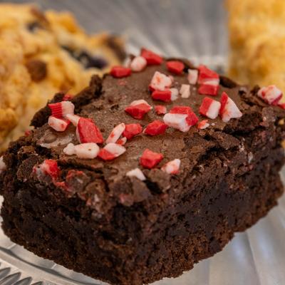 A plate with assorted baked goods on it, close up.