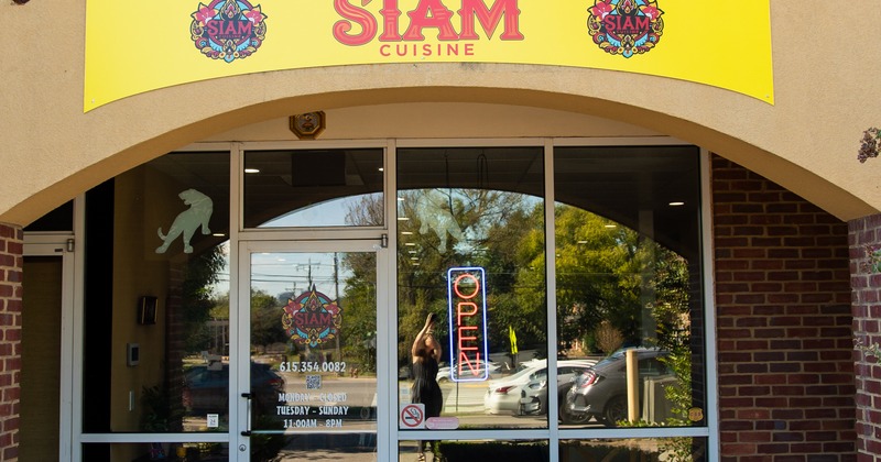 Exterior, front view to restaurant, entrance, sign above
