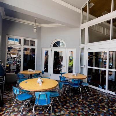 Interior, a small seating area with tables and chairs.