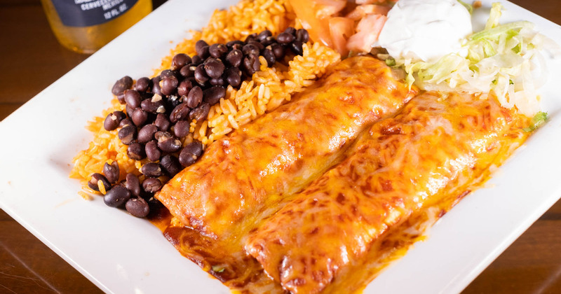 Rolled pastry with dip, rice on the side