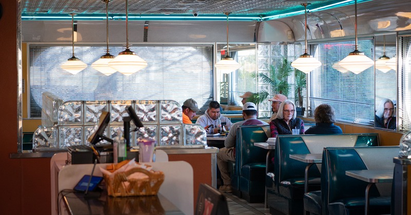 Interior, order counter and dining booths with guests