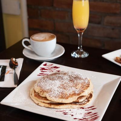Pancakes, coffee and orange juice.