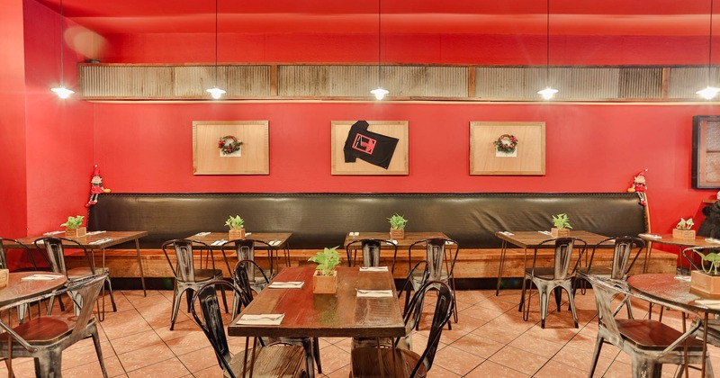 Interior, tables with chairs, booths at the back