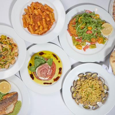 Assortiment of menu items served on the table, top view.