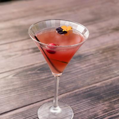 Manhattan cocktail on a rustic wooden table.