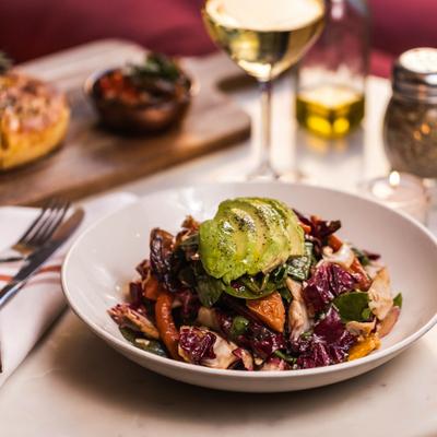 Grilled radicchio salad served with white wine.