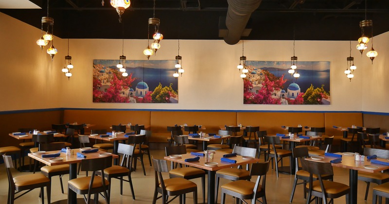 Spacious interior dining area with dining tables set for guests