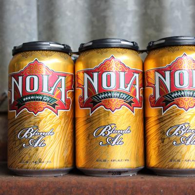 Cans of Nola Blonde Ale.