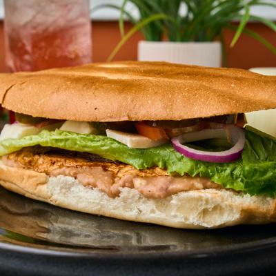Grilled chicken and steak torta sandwich.