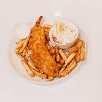 Fish and chips with sauce and coleslaw on the side