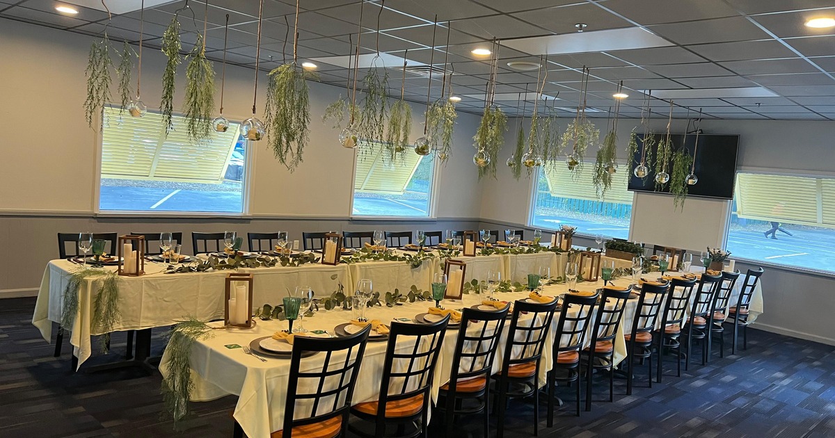 An elegant dining setup in a private dining room set for an upscale dinner gathering
