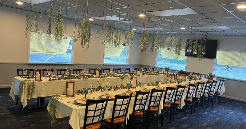 An elegant dining setup in a private dining room set for an upscale dinner gathering