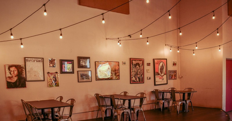 Interior, tables and chairs by the wall