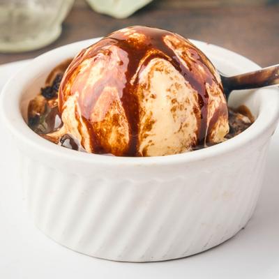Fudge Brownie Delight topped with ice cream and chocolate sauce.