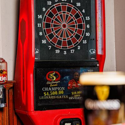 Electronic dartboard featuring an active tournament screen.