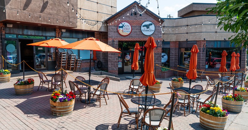 Outdoor seating area in front of the restaurant entrance