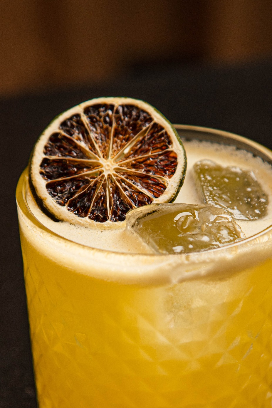 Yellow cocktail drink, closeup