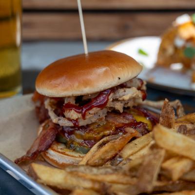 Bootlegger burger and fries on a tray.