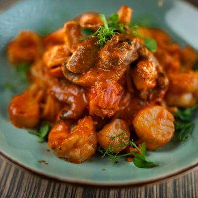 Spicy pasta with lobster meat, shrimp, scallops, mushrooms, and tomato sauce.