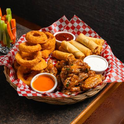 Pick three platter with assorted appetizers in a woven basket.