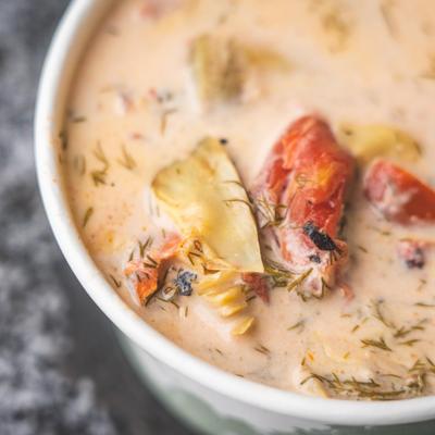 Tomatoes and artichoke soup with dill.