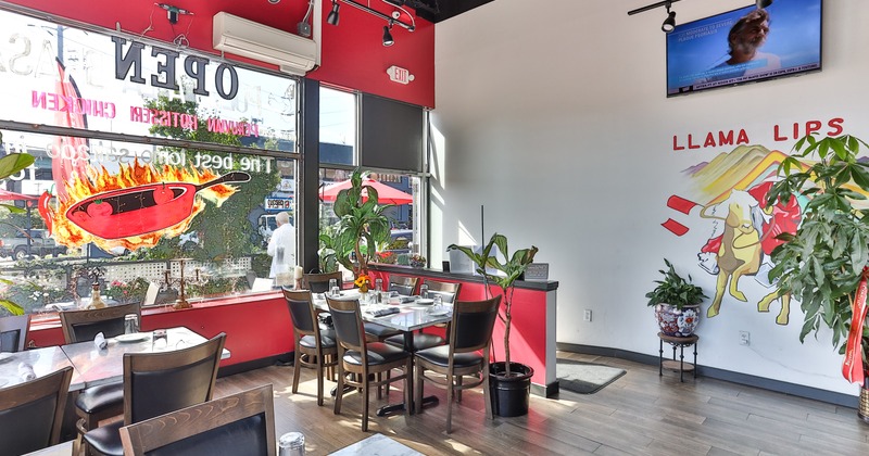 Dining tables set for guests near the entrance door