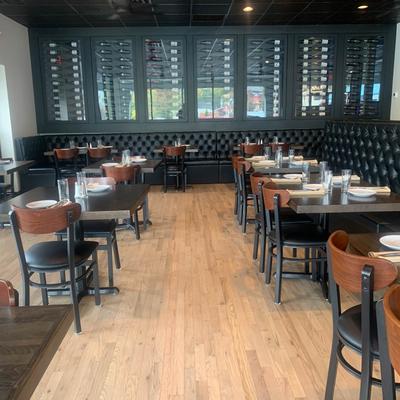 Interior, tables with table items, chairs and high back leather seating