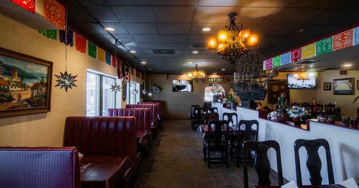 Interior of a Mexican-themed restaurant with vibrant decorations and dining booths