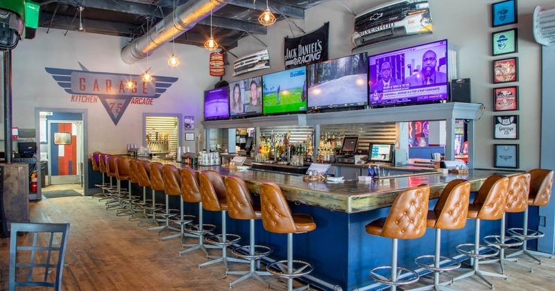 Interior, bar with lined up bar chairs