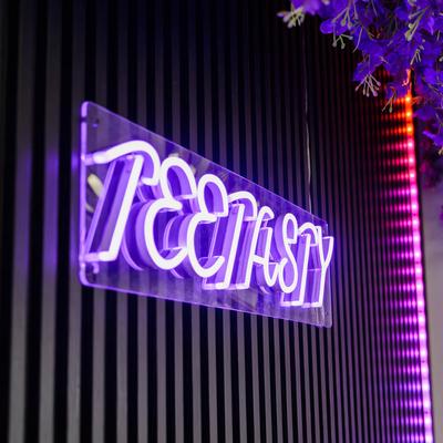 Neon sign on the wall.