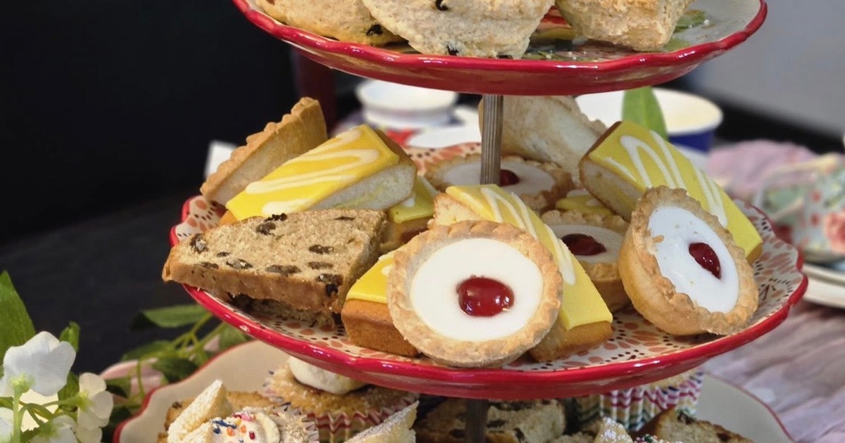 Multi-tier afternoon tea stand filled with assorted British-style baked goods