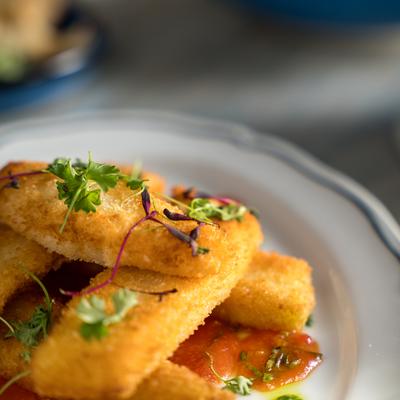 Calamari Fritti - Panko dusted Calamari Steak with Sweet Chili Tomato Basil Sauce.