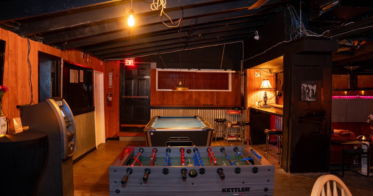 Interior, gaming area with high tables and chairs