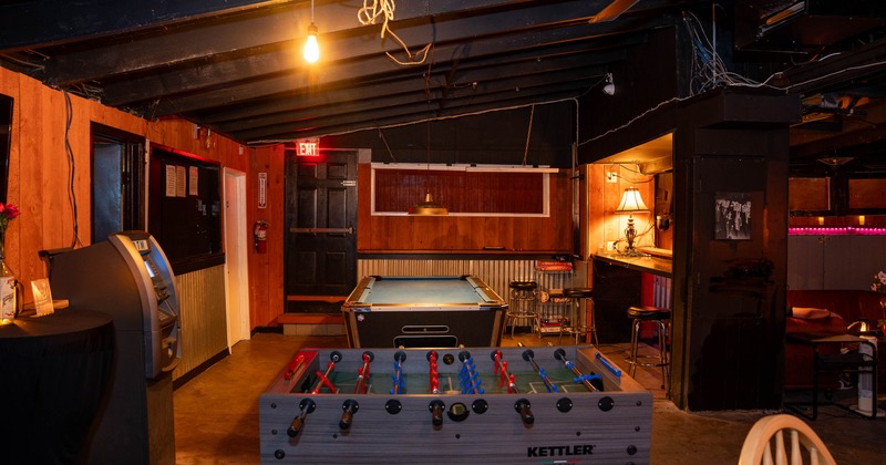 Interior, gaming area with high tables and chairs