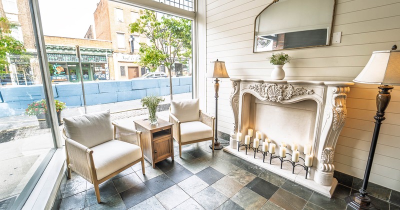 Interior, white sofa near the fire place