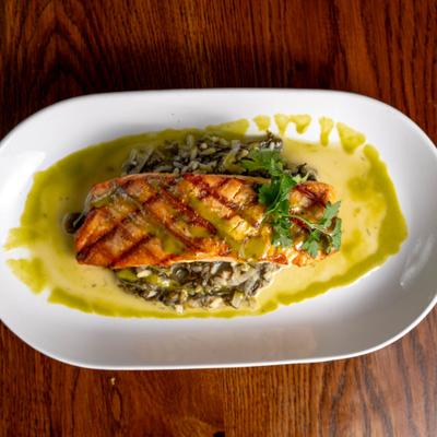 Grilled salmon on a bed of risotto.