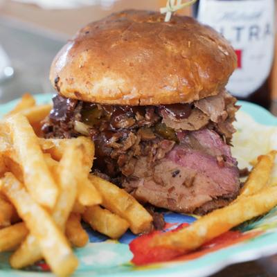 Smoked brisket sandwich with fries.