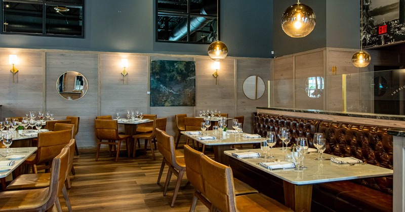 Interior, dining area with set tables and seating