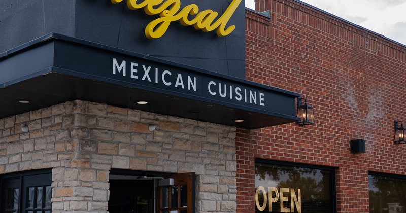 Exterior, front view to restaurant, entrance, sign above