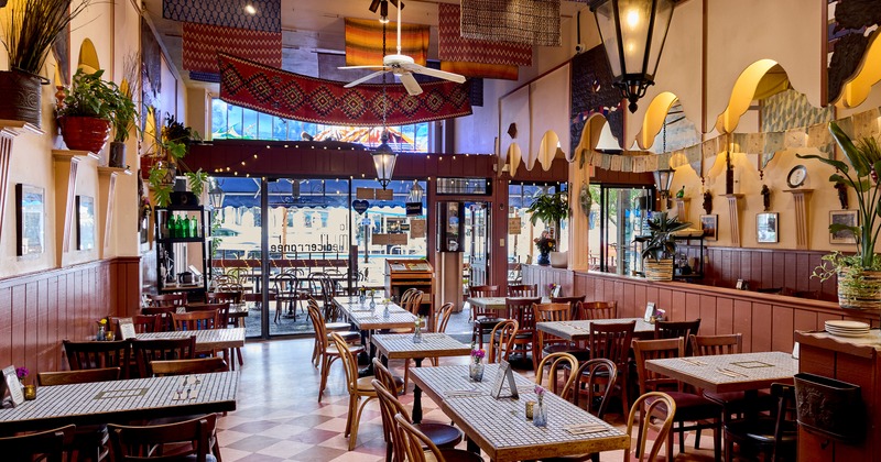 Spacious and cozy dining area with dining tables ready for guests