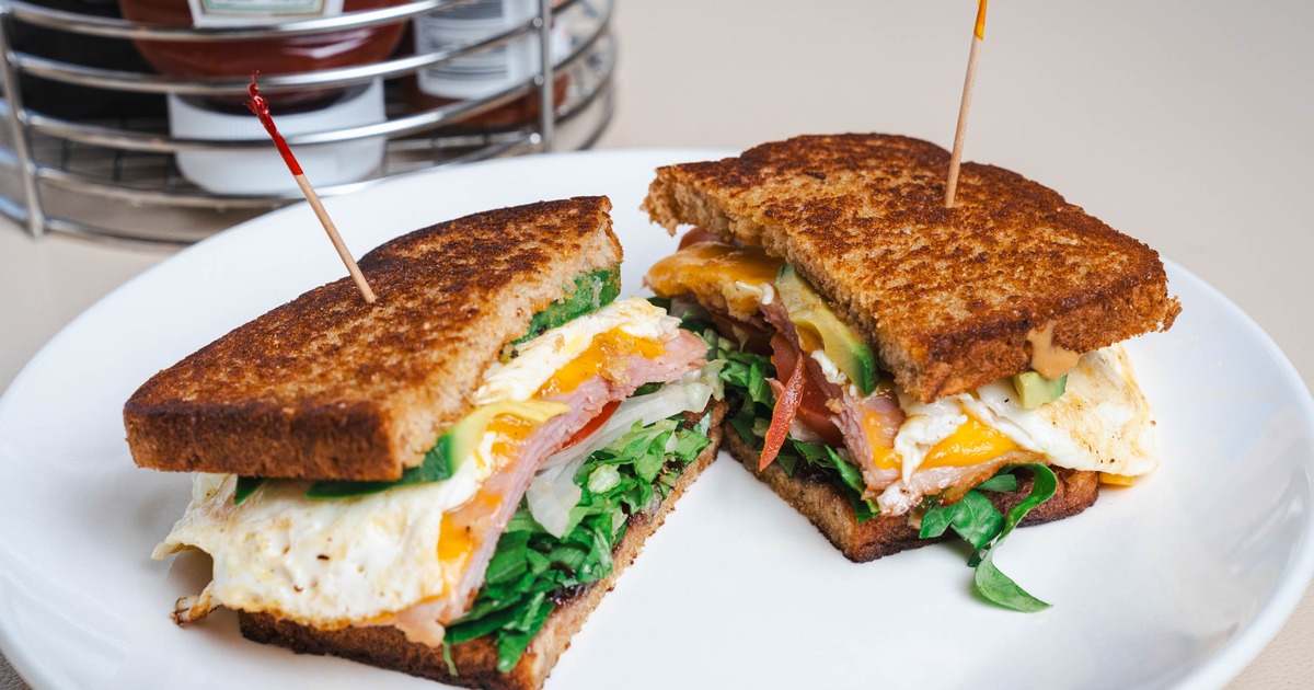 Sunrise Breakfast Sandwich sliced in half and served