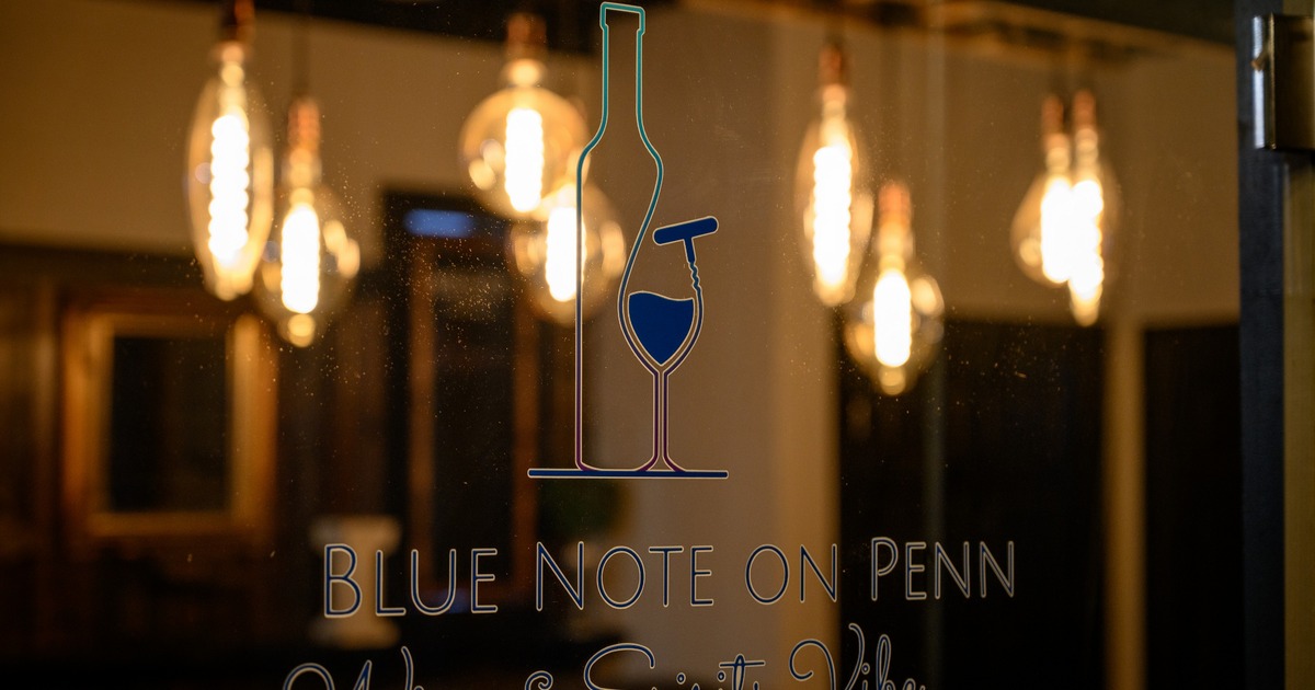 Interior, closeup on a wooden top table for eight, set up and ready for guests