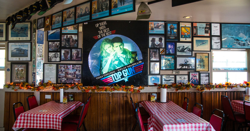 Interior, tables and chairs, pictures hanging on the wall