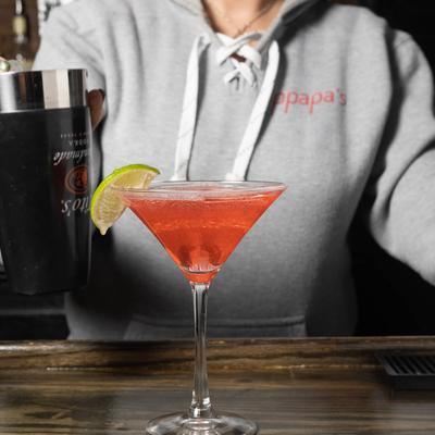 Cosmo cocktail on a bar counter.