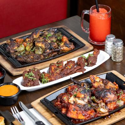 Various menu items served on the table with drinks.