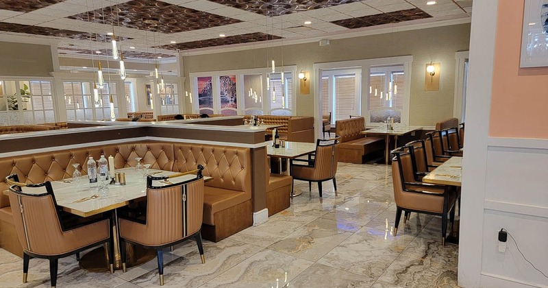 Interior of a modern restaurant featuring brown leather booths