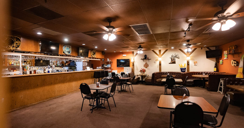 Interior, tables and chairs and bar view