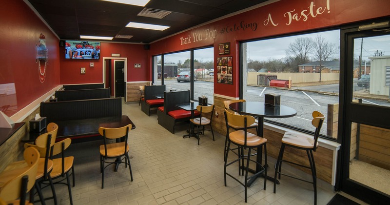 Interior, booth seating area, stools and tables