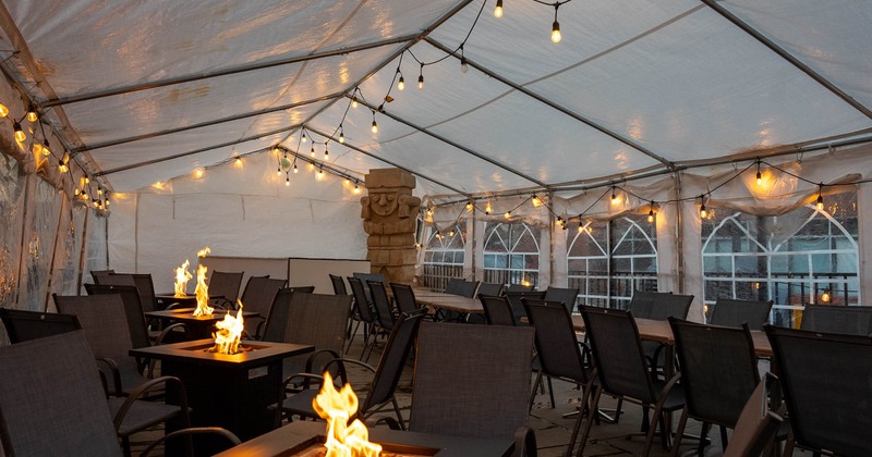 Exterior, large event tent, seating area, fire pit tables