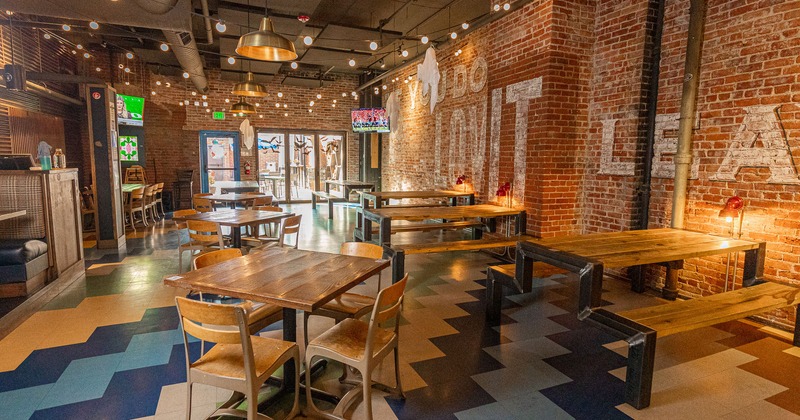 Interior, dining tables and booths, brick walls